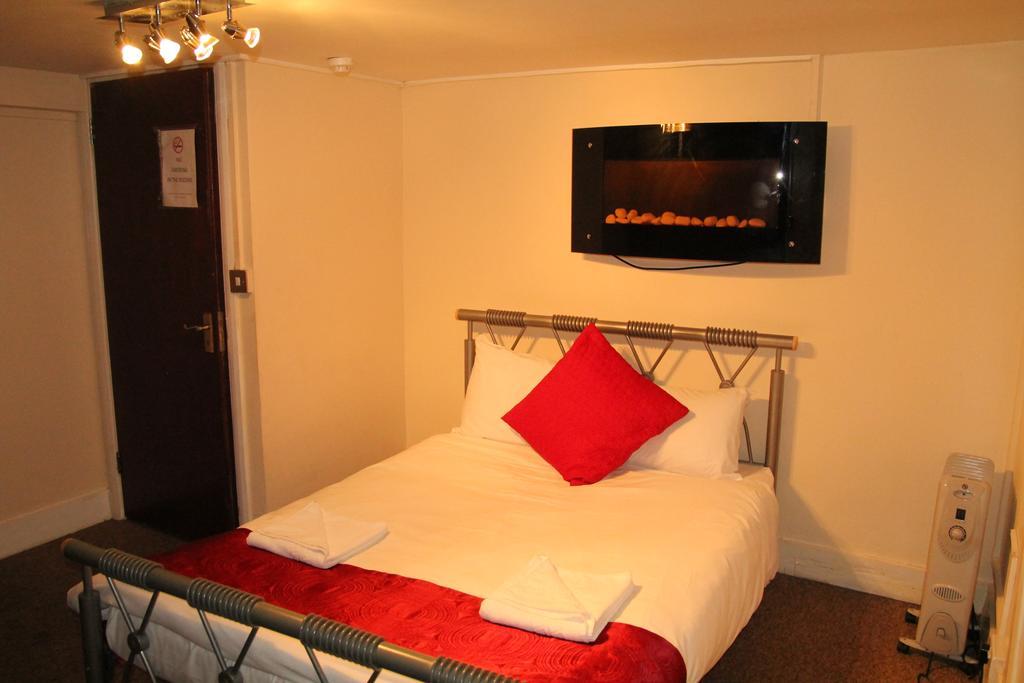 London Olympus Hotel Nirvana Habitación foto